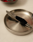 Noir Steel Plate with a fork and knife on a napkin