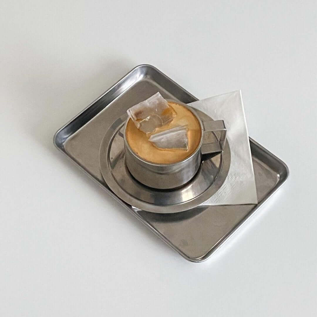 Minimalism stainless steel serving tray with elegant design, showcasing a cup and saucer, perfect for stylish serving and display.