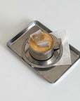 Minimalism stainless steel serving tray with elegant design, showcasing a cup and saucer, perfect for stylish serving and display.