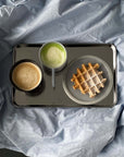 Minimalism Stainless Steel Serving Tray with a matcha latte and a waffle on white linen