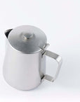 Vintage INOX cafe pot made of stainless steel, featuring a chic design suitable for various uses, shown with a lid and handle.