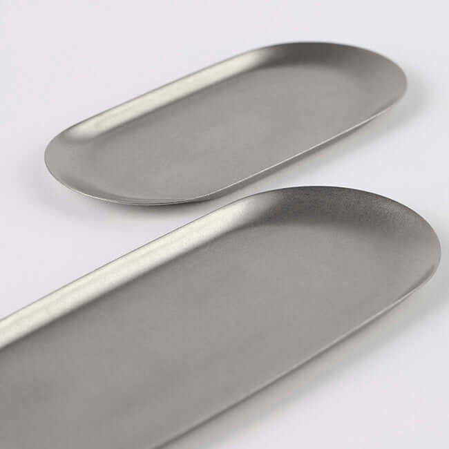 Vintage INOX oval trays made of 18-8 stainless steel, showcasing chic and durable design. Available in small and large sizes. Dishwasher safe.
