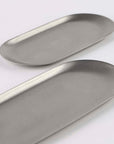 Vintage INOX oval trays made of 18-8 stainless steel, showcasing chic and durable design. Available in small and large sizes. Dishwasher safe.