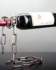 Chain wine bottle holder creating a floating illusion with a suspended wine bottle on display.