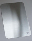 Minimalist SUS 316 stainless steel cutting board with sophisticated design, ideal for serving and display, dishwasher safe.