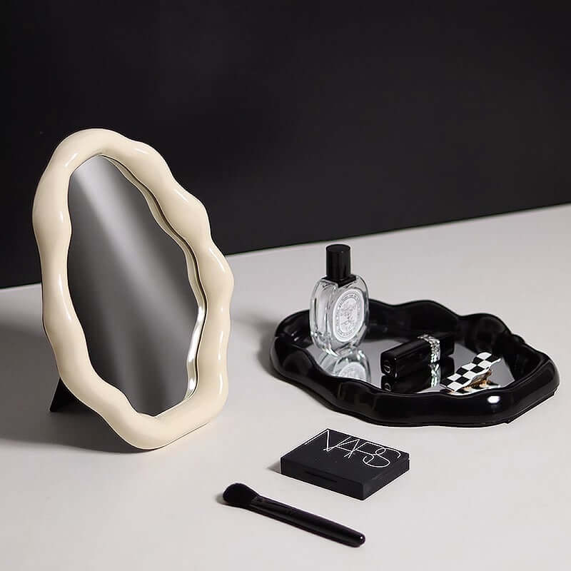 Nordic cloud-shaped vanity mirror with elegant design, featuring a 27x20cm size on a makeup table with cosmetics and perfume.