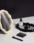 Nordic cloud-shaped vanity mirror with elegant design, featuring a 27x20cm size on a makeup table with cosmetics and perfume.