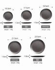 Set of Hakone Plates in varying sizes and weights, showcasing matte stainless steel finish and minimalist design.