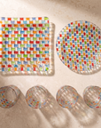 Everything in the square Tessera Table set laid out from above: square platter, 23.5 cm plate and four glasses
