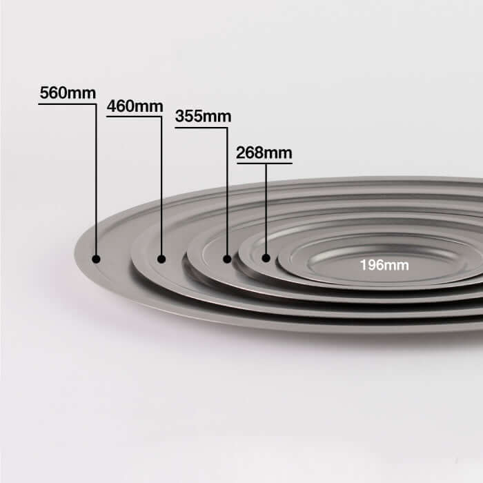 Five stacked VINTAGE INOX oval plates of varying sizes, made from durable stainless steel, showcasing design and dimensions.