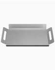 Sleek steel griddle plate with handles for easy handling, perfect for cooking in kitchens or on grills.