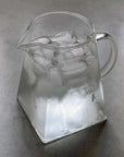 Aeris Frosted Glass Pitcher filled with iced water