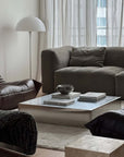 Kyoto Stainless Steel Bowls on a coffee table in a living room with a grey sofa