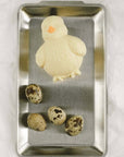 Industrial Stainless Steel Tray with a chick-shaped pudding and quail eggs