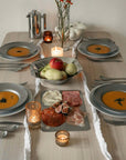 Artisan Pasta Plates set on a dinner table with soup, candles and autumn decorations