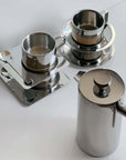 Stainless steel coffee set with Italian style cups and modern design elements.