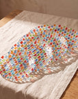 The four Tessera plate sizes fanned out on a linen runner, from 16.7 cm to 33.6 cm