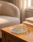 Tessera hand-painted mosaic plate 16.7 cm on an oak side table