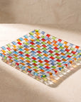 Close-up of the woven glass texture of the Tessera square platter in sunlight