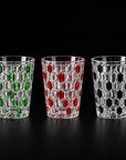 Green, red and black Vetra Raindrop hand-painted glasses side by side on a black background