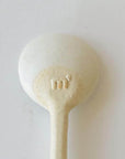 Marumitsu Bean Spoon with rustic semi-matte finish and bean-shaped tip showing unique glaze design on white clay.