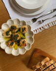 Scallops served on 21cm Rinka Plate by Kaneko Kohyo, showcasing handcrafted Japanese porcelain elegance on dining table.