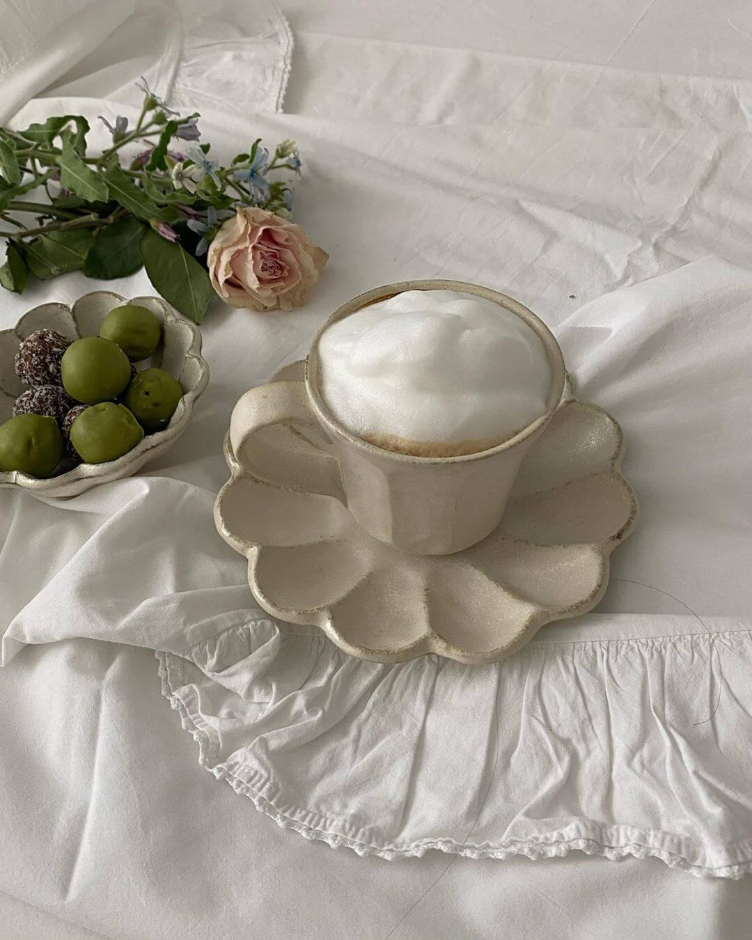 Luxurious Rinka handcrafted dish with a drink, showcasing natural flower petal design, perfect for a dream-like dining experience.