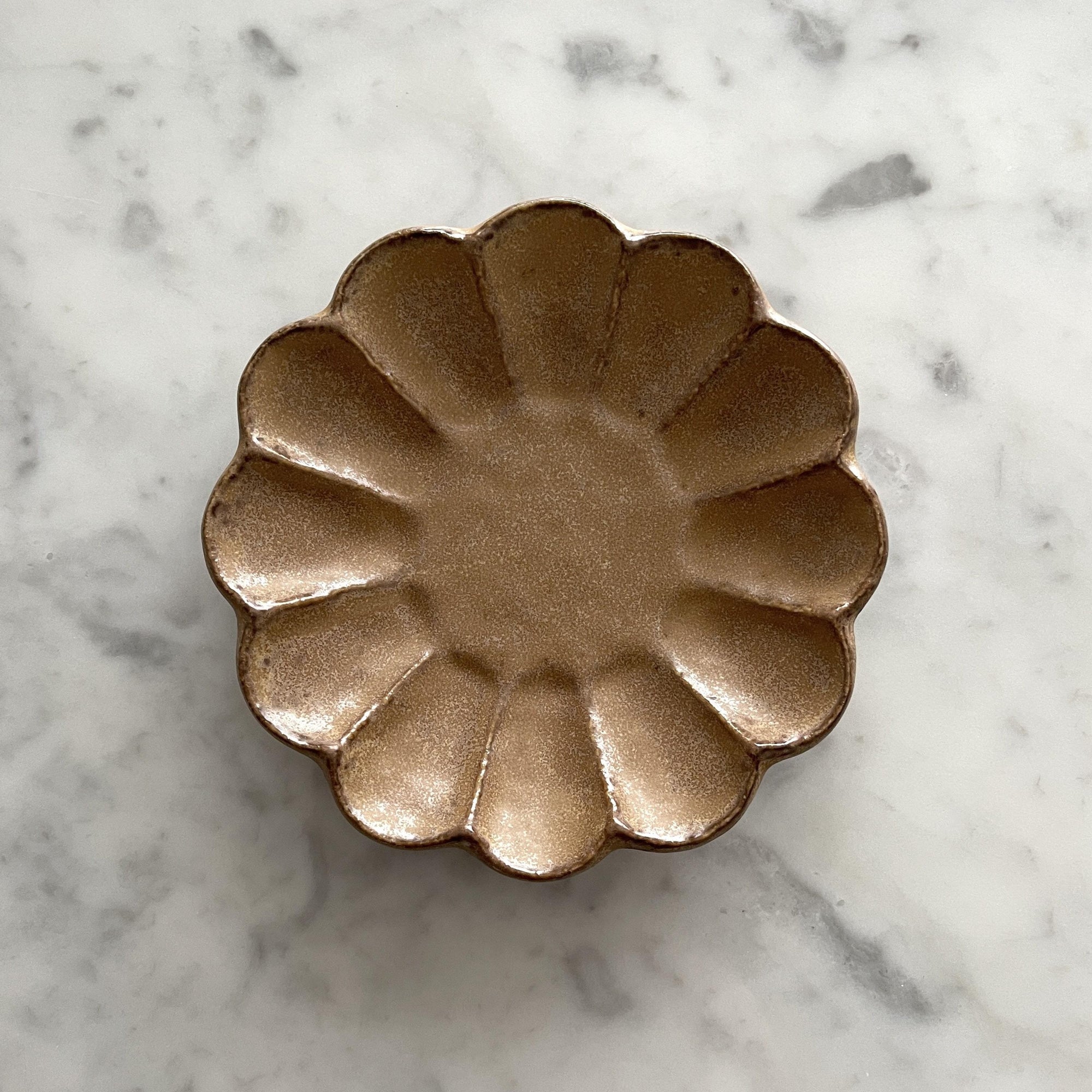 Elegant Rinka Plate 14cm in porcelain, handcrafted in Japan, showcasing timeless design on a marble surface.