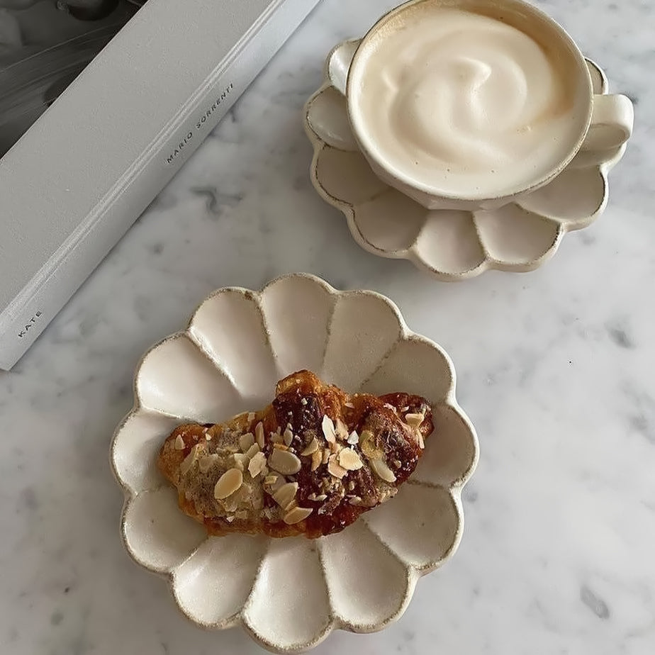 Elegant Rinka plate set with a croissant and coffee, showcasing Kaneko Kohyo's Japanese craftsmanship on a marble surface.