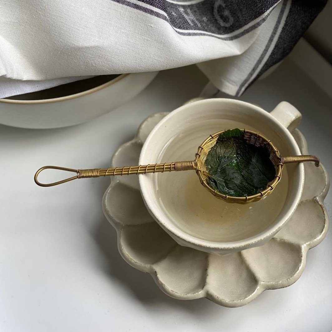 Rinka Soup Cup by Kaneko Kohyo with tea strainer, floral porcelain design, perfect for enhancing table settings, handcrafted elegance.