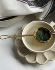 Rinka porcelain soup cup and flower-shaped plate with a tea strainer, part of Kaneko Kohyo's handcrafted collection.