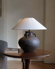 Handmade ear table lamp with old pottery design, unique craftsmanship, soft light diffusion, and warm room ambiance.