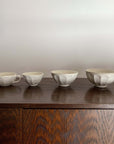 Rinka Medium Soup Bowl 14.5cm and matching set on wooden table, handcrafted porcelain with flower shape, Kaneko Kohyo Japan.