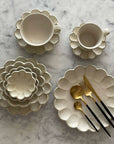 Elegant Rinka Bundle 2 tableware with flower petal design, showcasing Japanese craftsmanship by designer Kaneko Kohyo.