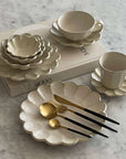 Elegant Rinka Bundle 2 dinnerware set with flower petal design, showcasing handcrafted Japanese and Western style fusion on marble surface.