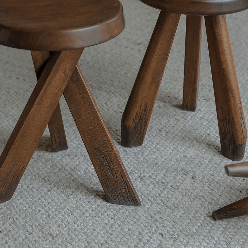 Meribel stool made of imported teak wood with a design inspired by the Alps, featuring manual polishing and charcoal burning finish.