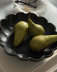Black Rinka Bowl by Kaneko Kohyo holding three green pears on a table.