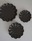 Rinka Collection black porcelain plates in three sizes, handcrafted in Japan.