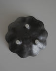 Black Rinka Bowl 12cm with flower shape, handcrafted from porcelain by Kaneko Kohyo, showcasing delicate design and unique style.