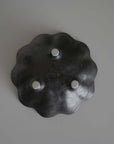Black porcelain Rinka Bowl 10cm from Kaneko Kohyo, flower-shaped with handcrafted details, black glaze, viewed from top. Made in Japan.