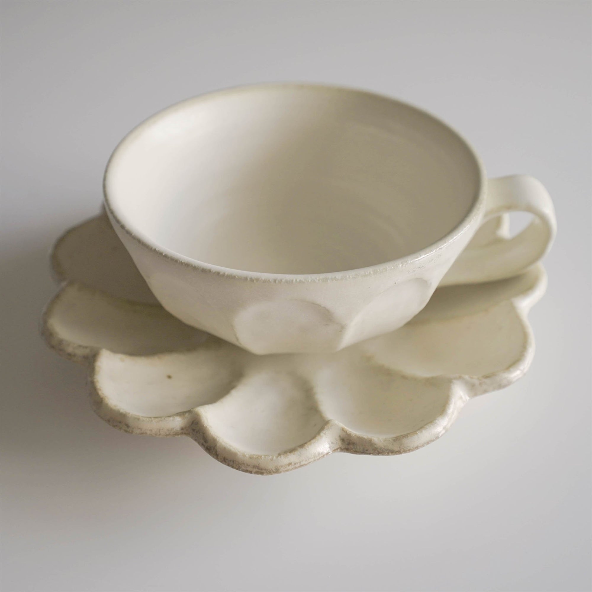 Elegant white Rinka soup cup by Kaneko Kohyo, crafted from delicate porcelain with a flower shape, perfect for enhancing any table setting.