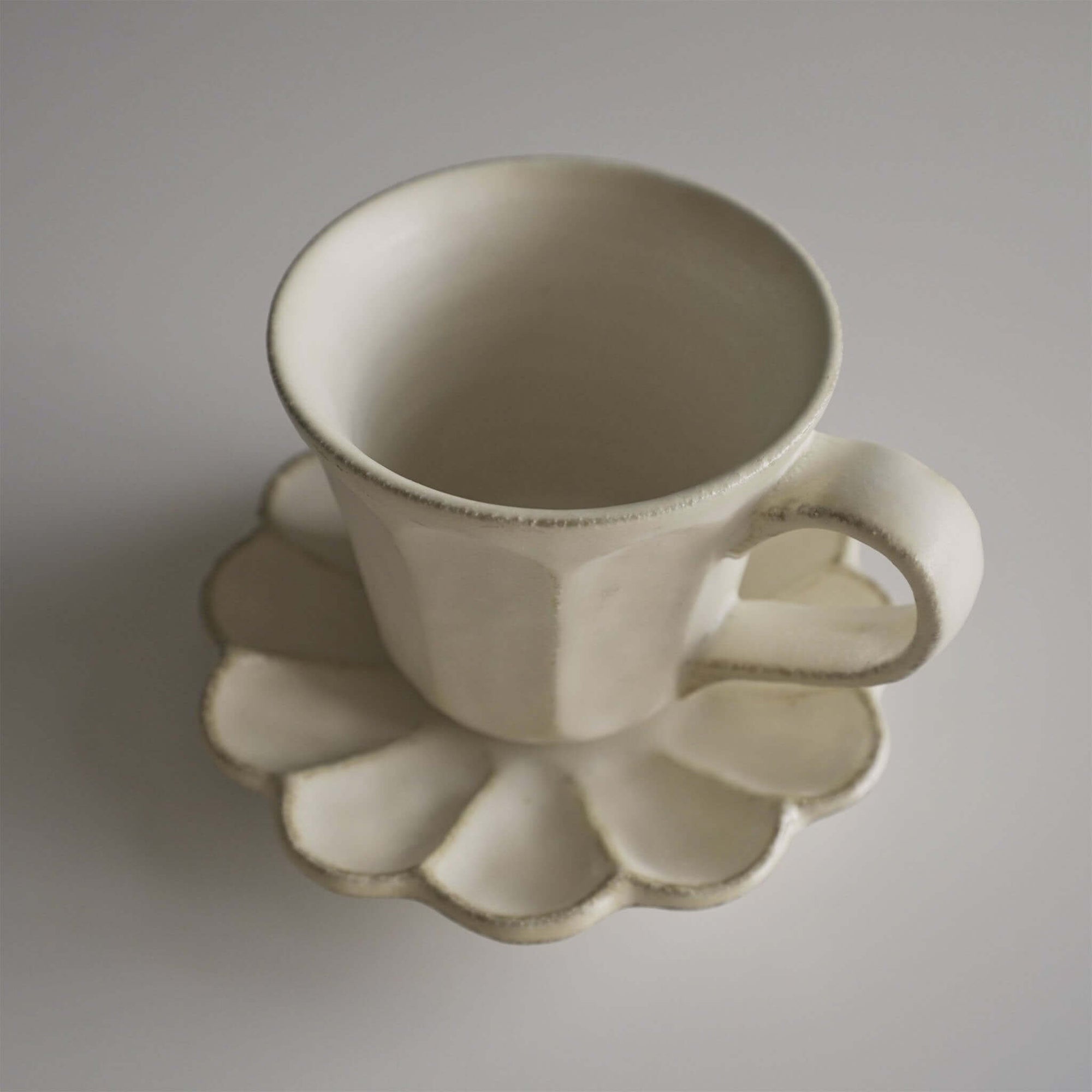 Rinka Mug & Plate Set in porcelain, featuring a uniquely textured glaze, handmade in Japan. Microwave and dishwasher safe.