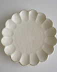 Elegant Rinka Plate 24cm in porcelain, handcrafted in Japan, featuring a timeless design with scalloped edges. Microwave and dishwasher safe.