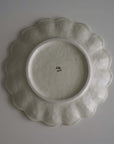 "Rinka Plate 24cm base view, handcrafted porcelain with elegant scalloped design, made in Japan, microwave and dishwasher safe"