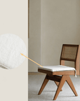Hand-made wood-mounted dining chair with rattan weave, featuring pure lines and teak construction; adds romantic vibe to any space.