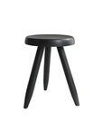 Black Meribel Stool made from imported teak wood with alpine-inspired design and manual polishing, perfect for architectural elegance.