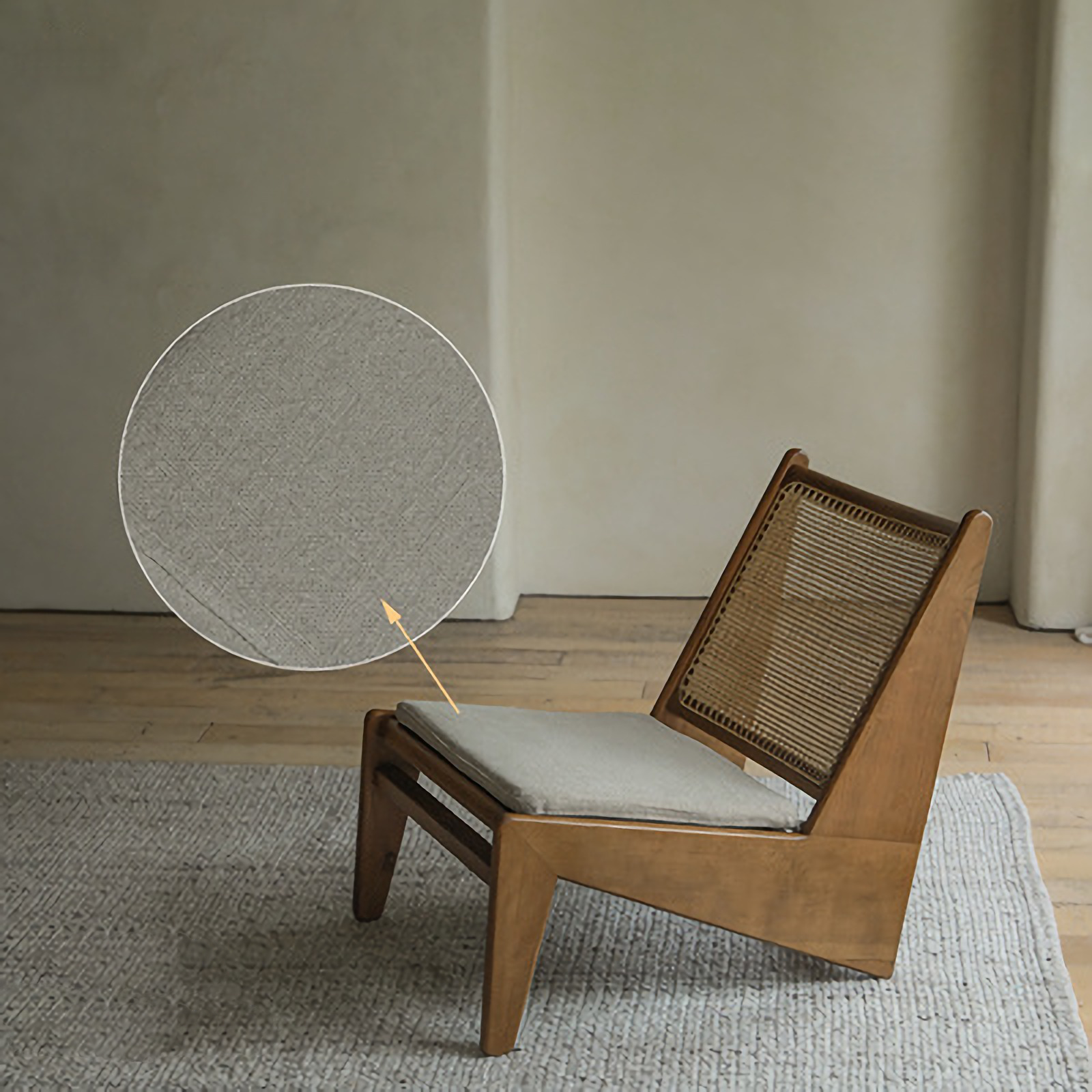 Kangaroo Chair with rattan and solid wood frame, featuring a Z-shaped design and close-up of fabric texture, on a wooden floor.