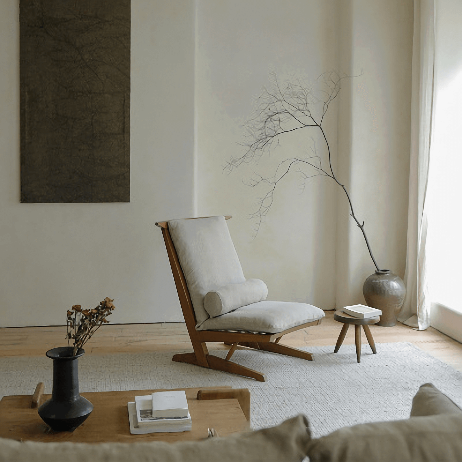Nakajima George Reclining Chair in a minimalist living room, showcasing its teak wood frame and hand-woven rattan design.