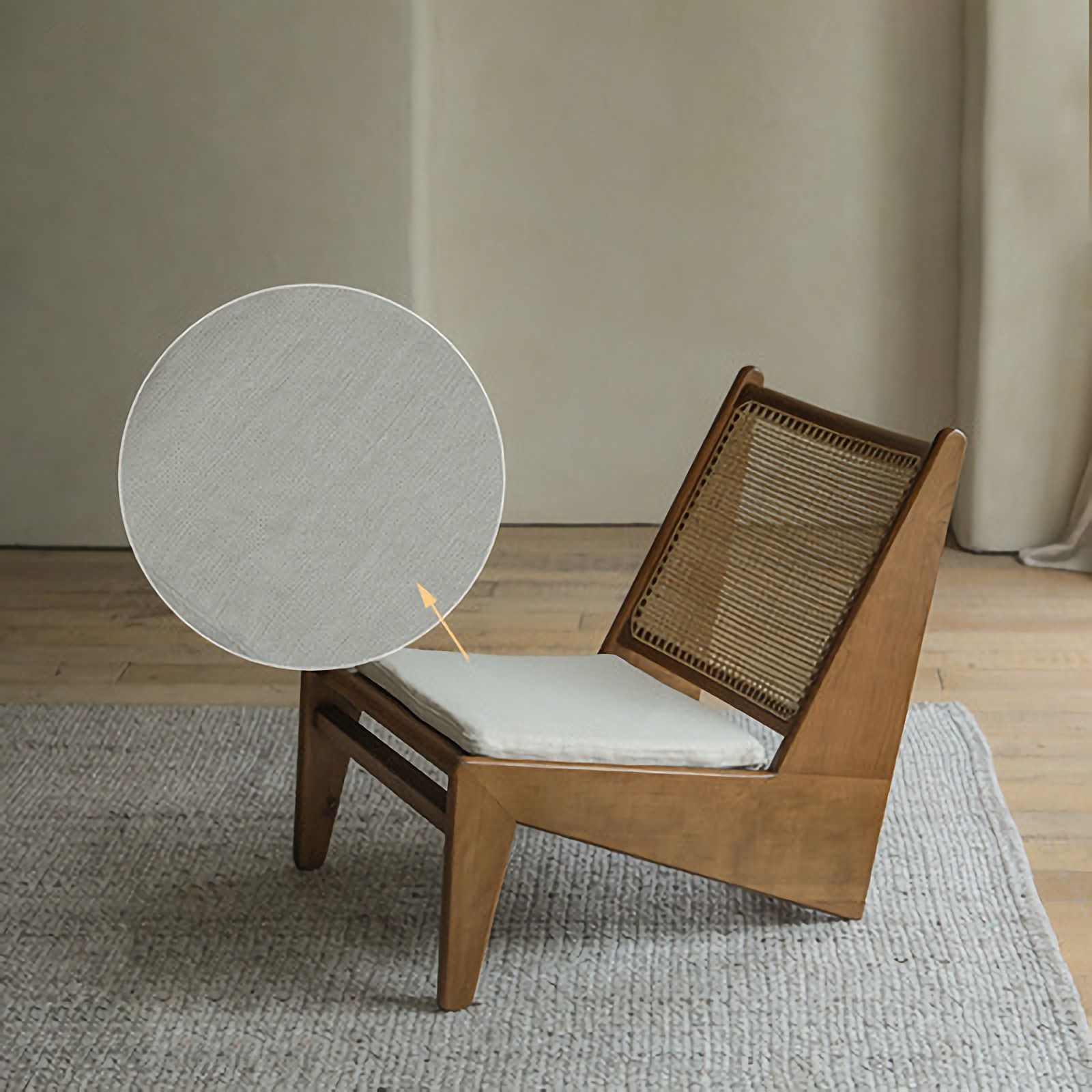 Kangaroo Chair with rattan and solid wood in Z shape design, featuring a textured cushion and curved backrest on wooden flooring.