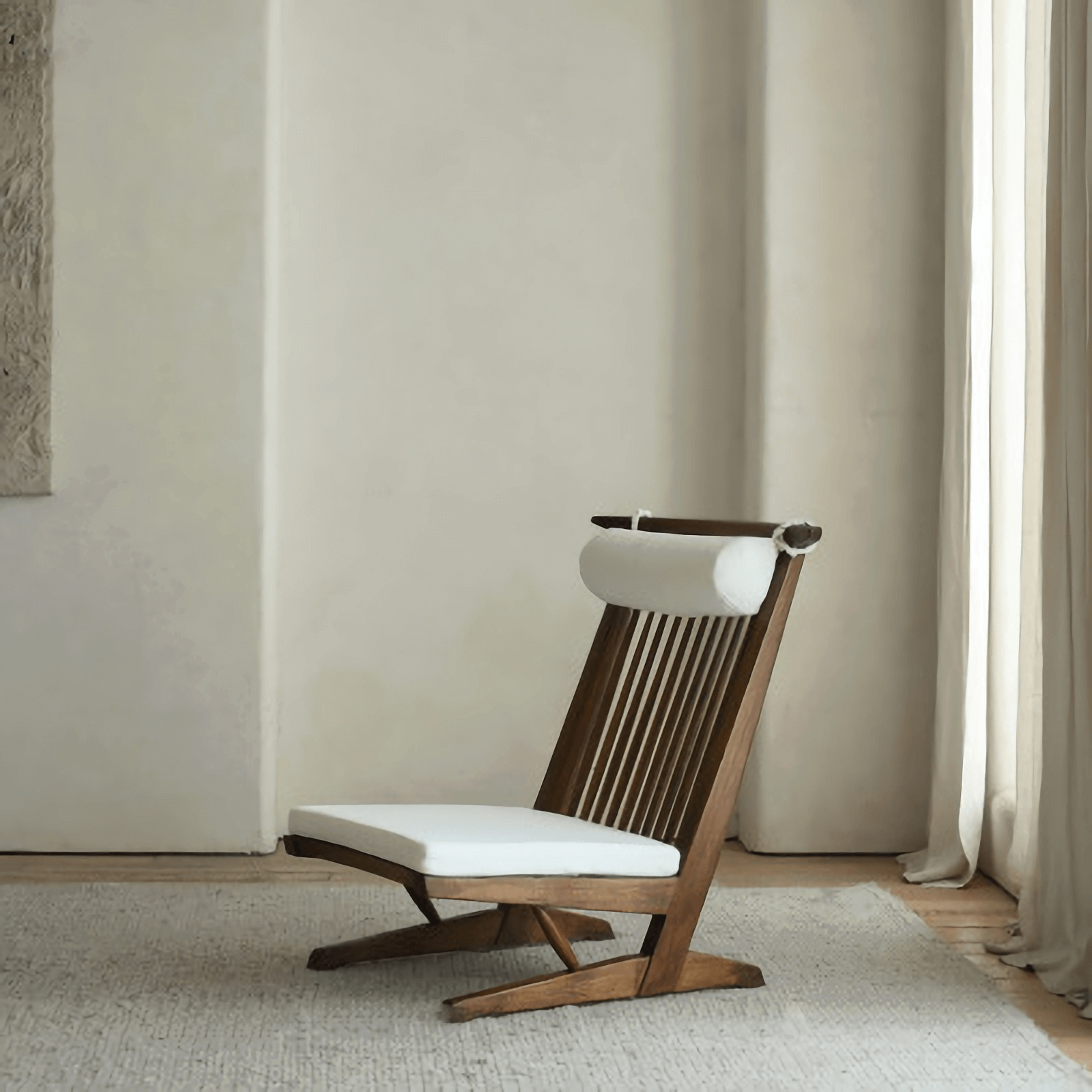 Nakajima George Reclining Chair with hand-woven rattan and teak wood frame, offering a romantic and elegant design for interiors.